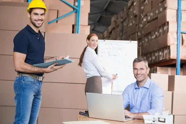 warehouse-team-working-together-on-shipment